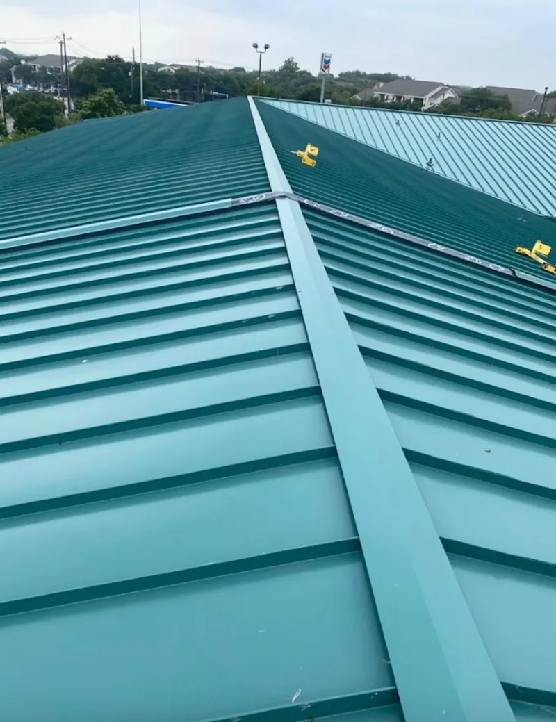 Green commercial metal roof ridge and valley for Metal Roof Repair in Malta