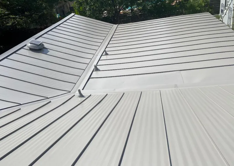 Solar attic fan installed on a metal roof for Roof Ventilation in Malta